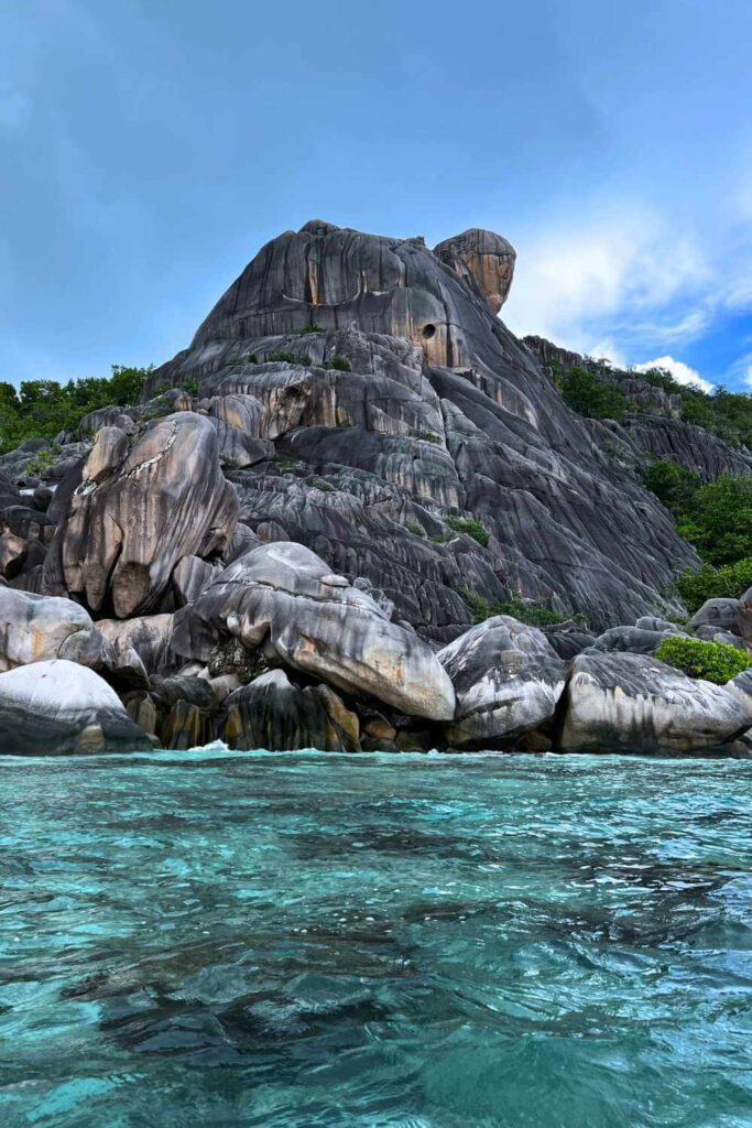Crystal Water Kayak Robinson Crusoe Tour on La Digue Seychelles is a must do on La Digue. It is a perfect mix of activity, education and relaxation. Admire the views of Anse Source D'Argent, learn a few survival skills, crack a coconut and step on a move set. Read an honest tour review of Anja On Adventure. | Robinson Crusoe island | Visit Seychelles | La Digue | Anse source D'Argent | Anse Pierrot #setjetting #instagrammable #mahe #praslin #kayaking